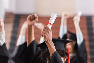 Cropped view of african american student holding diploma