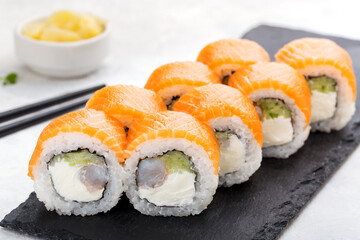 Sushi roll set with salmon, cucumber, cream cheese. Sushi menu. Japanese food.