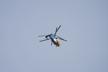  A lone helicopter in the air. Copy space. Blurred in motion.