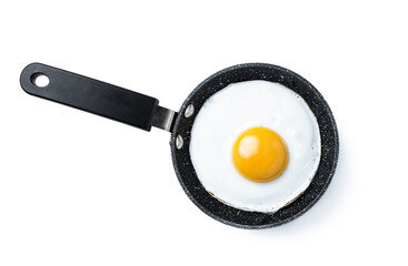 Fried egg in small frying pan isolated on white. Top view