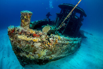 Diver on the wreck of a small tugboat off Grand Case on the French island of St Martin