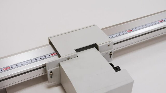 High precision digital cutting system - flatbed cutter, router during work with plastic sheet at factory, exhibition. Technology, industrial, robotic, electronic, production, manufacturing concept. 4K