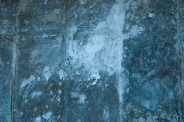 concrete wall. the foundation of the house. gray corrugated texture. plaster surface of a building