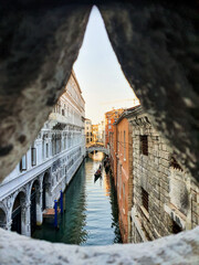 View from the bridge of sighs towards a peaceful canal in Venice, Italy.