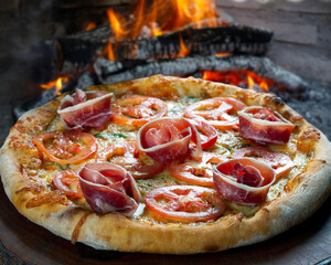 Pizza of Parma ham and tomatoes roasted in the wood oven