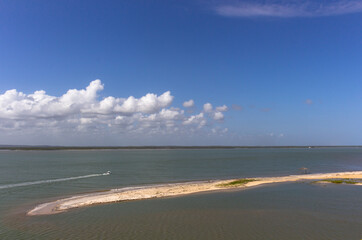 Vegetation and sand dunes of the dry mangrove (Dunas do Mangue Seco) in Bahia providing a beautiful view of the blue sea.