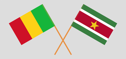 Crossed flags of Mali and Suriname. Official colors. Correct proportion