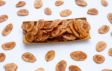 Banana chips on white background.