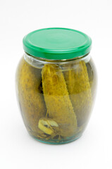 Pickled cucumbers in a glass jar on a white background