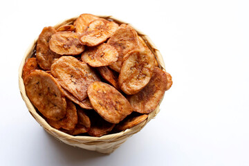 Banana chips in basket on white