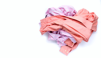 Pile of used clothes on white background.