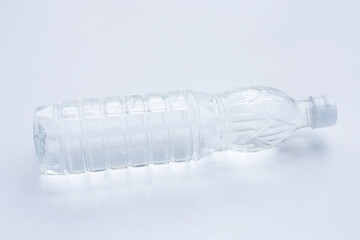 Plastic bottle of white vinegar on white