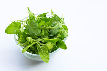Holy basil leaves with flower in glass bowl on white