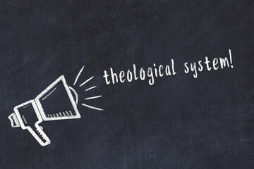 Chalk loudspeaker and inscription theological system on black chalkboard