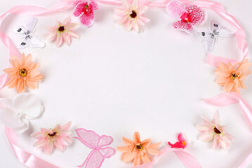 Spring or summer flower composition, still life, banner, minimal holiday concept, delicate orchid flowers flat lay. Greeting card for mothers day, womens day, lovers day, happy birthday,