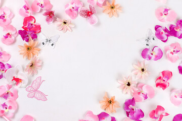 Holiday concept with flowers, spring or summer composition, still life, banner,delicate orchid flowers flat lay. Greeting card for mothers day, womens day, lovers day, happy birthday,