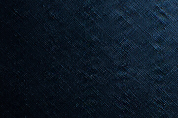 dark creative background: black primed linen canvas, uneven lighting, color toning