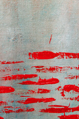 abstract creative background: red blurred stains of colored primer when toning the canvas,...