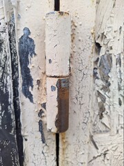 old and rusty metal door hinge closeup photo