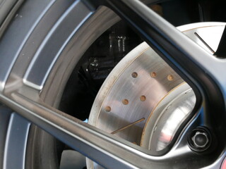 closeup of car brake disc in a modern car.