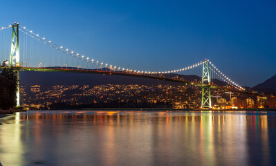 Lions Gate Bridge at twilight. View from Stanley Park Seawall. Vancouver, British Columbia, Canada.