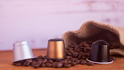 Coffee capsule and roasted coffee beans with burlap sack 