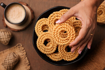 Rice murukku , savoury , chakli, chakali Indian milk tea chai Kerala snack deep fried coconut oil traditional South Indian Tamil Nadu India, Sri Lanka,   Onam, Vishu, Diwali Deepawali, Ramadan, Eid