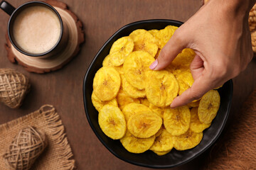 banana chips, popular Kerala snack deep fried in  coconut oil. traditional South Indian tea time snack on banana leaf, Kerala India on Onam, Vishu, Diwali, Ramzan