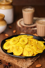 banana chips, popular Kerala snack deep fried in  coconut oil. traditional South Indian tea time snack on banana leaf, Kerala India on Onam, Vishu, Diwali, Ramzan