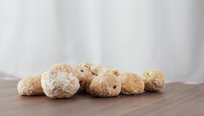 A handful of assorted chips on a wooden table - Stuffed Cavaca.
