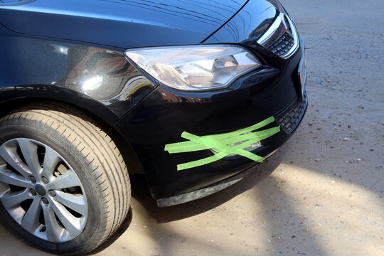 Black Car Wrapped In Green Duct Tape