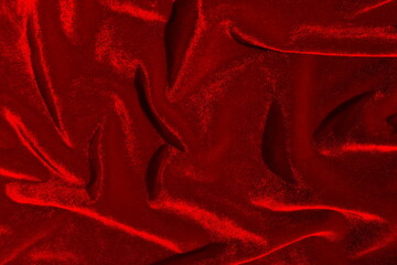 Texture of crumpled velvet fabric that shines in the sun