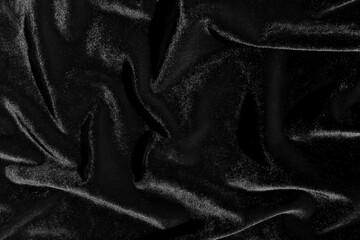 Texture of crumpled velvet fabric that shines in the sun