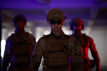 soldier squad team walking in urban environment colored lightis