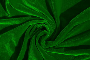 Texture of crumpled velvet fabric that shines in the sun