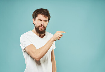 Nervous man on blue background gesturing with hands cropped view