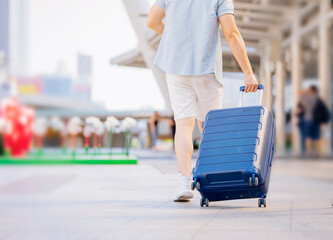 Couple Man Woman traveler with suitcase on businesses centre building  background