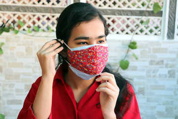 double mask prevent infection, Young indian girl wearing two face mask to protect from new strain...