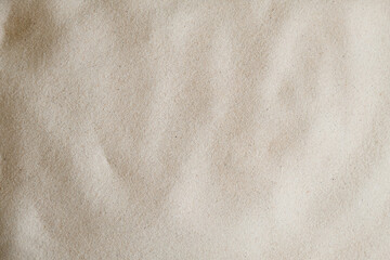 Wavy fine sand texture. Natural background, close-up