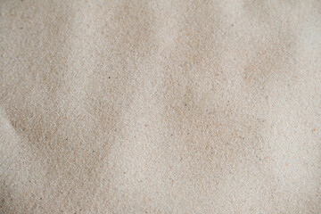 Wavy fine sand texture. Natural background, close-up