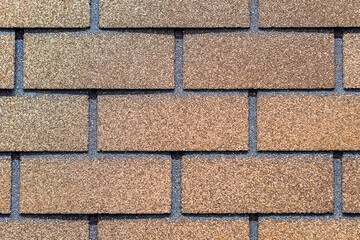 Fototapeta premium Brown Background is made of artificial stone. Side view, indoors horizontal shot.