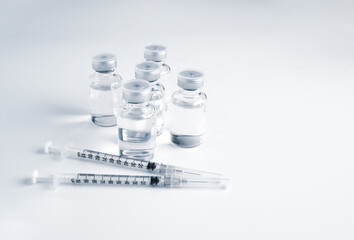 Empty bottle of vaccine with syringe for hygiene injection. Pharmaceutical equipment protective...