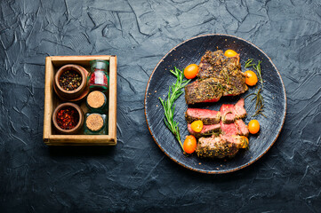 Juicy beef steak with kumquat