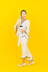 Portrait beautiful young business asian woman with smart mobile phone