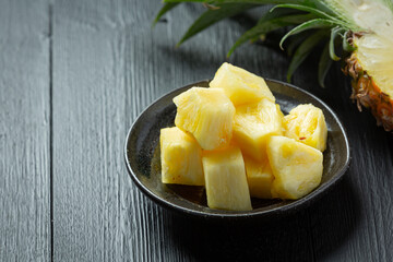 fresh pineapple on dark wooden backgroud
