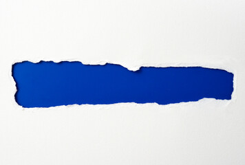 torn paper frame with the ripped sides. a blue hole of torn on the white paper. realistic torn...