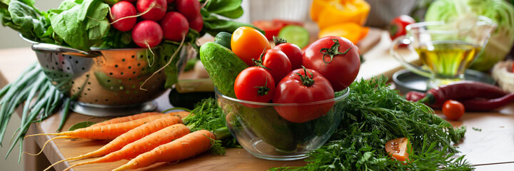 Concept of clean eating, organic healthy food, low calories meal, dieting, self caring lifestyle. Colorful fresh vegetables from the market, ingredients for light summer salad for lunch. Banner