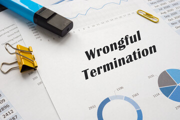  Wrongful Termination phrase on the piece of paper.