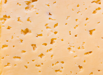 Yellow cheese texture for appetite food background image.