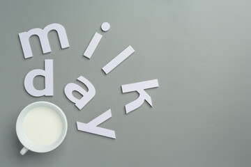 glass of milk on gray backgroud